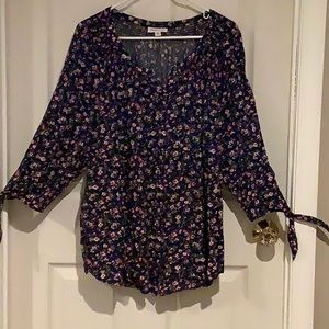 Navy blue floral print smocked blouse.